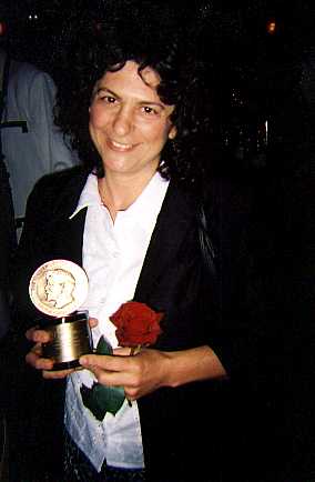 Rachel holding the Peabody Award