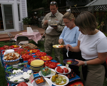 Todd, Ingrid, and Mumble compare tomatoes