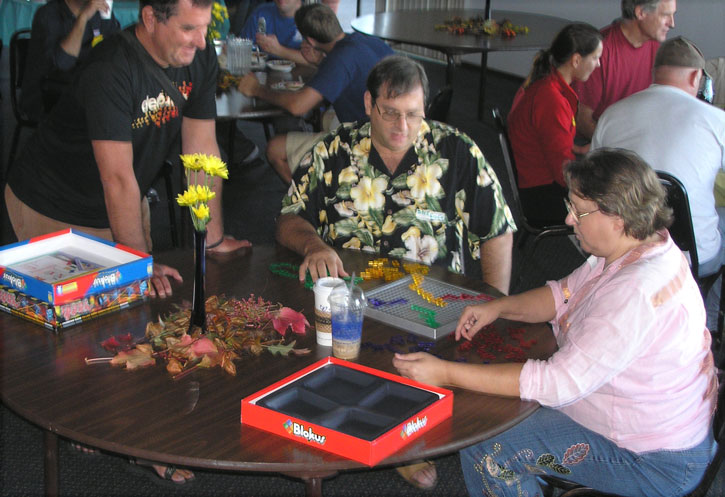 Pie judge dkeisen (center) plays Blokus with ditt while jef looks on