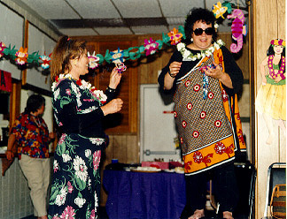 "I won a prize ... for... um... I think it was for "Best Hawaiian outfit older than the person wearing it." My two-piece beach wrap -- a wrap-around skirt slit up nearly to my belly button with a matching bolero-style cap-sleeved blouse that knotted between my boobs, black-background Hawaiian floral "silky" material -- dates back to the mid-'40's. So, yes, it is older than I am, though not by much." -- (peoples)
