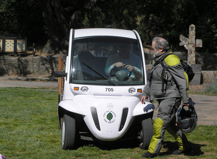 flash gets a ride in the electric cart provided by the park service