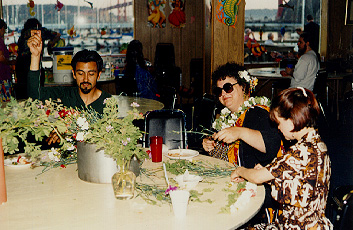 "... (latiny) had a splendid '50s tapa cloth print Hawaiian dress on. A strapless number with "bones" in the bodice so it stands up by itself even if you're not wearin' it. And a matching little bolero jacket. I was deeply impressed." -- (peoples)