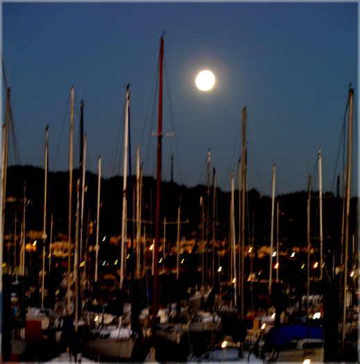 and a full moon rising in the east